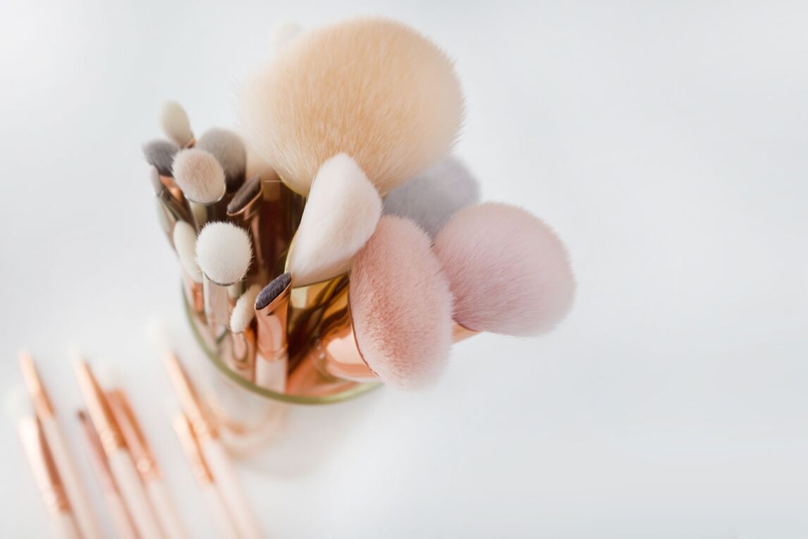 makeup brushes in glass jar