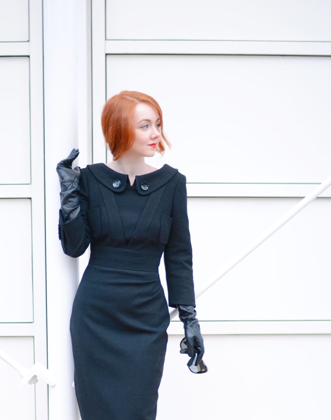 redhead in black 40s style wiggle dress