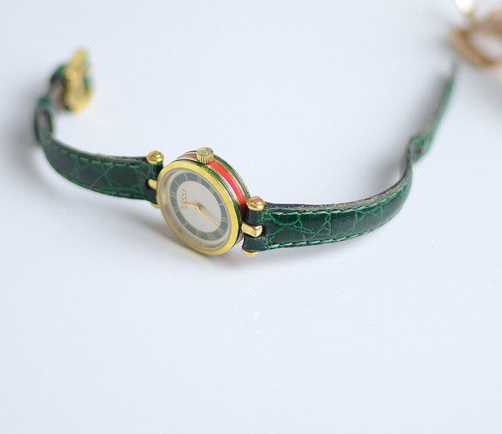 Green Gucci watch