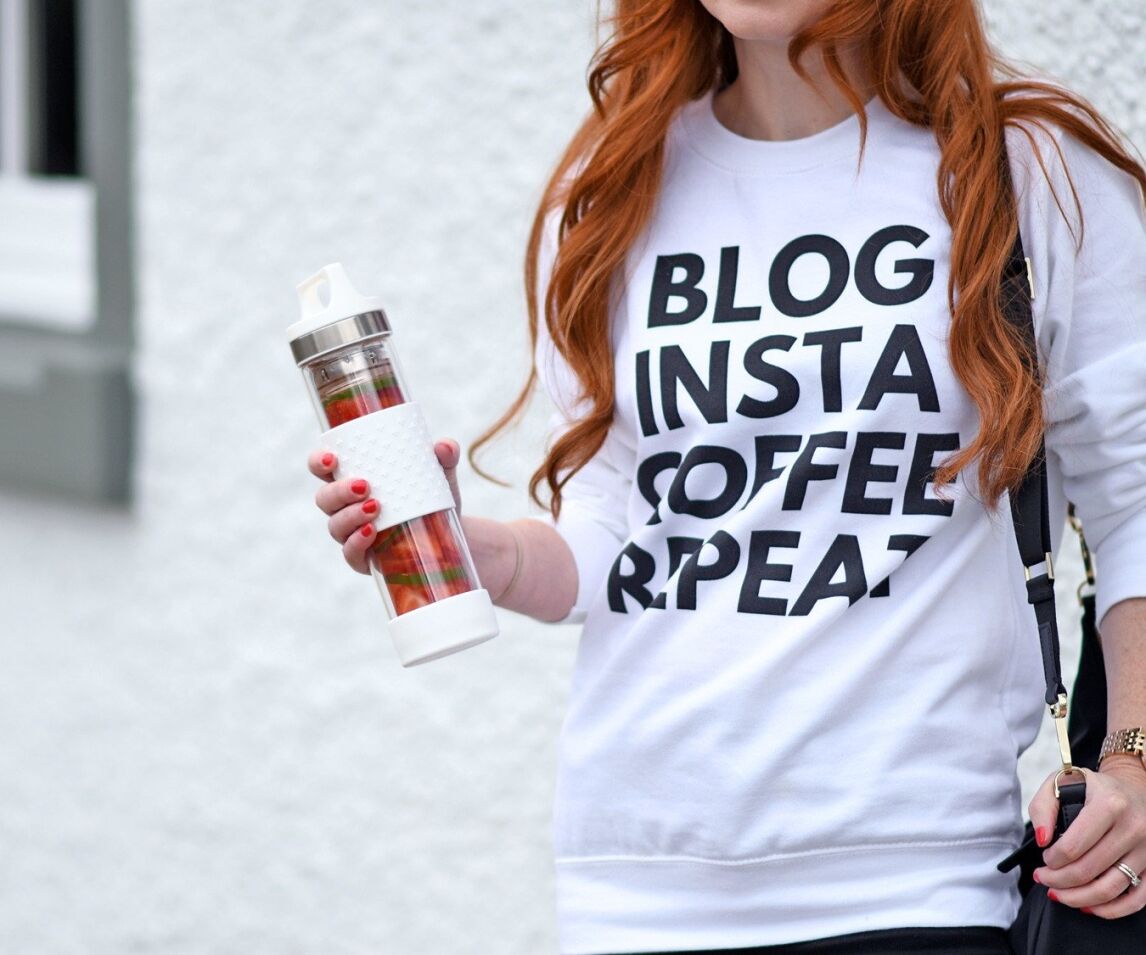 Sigg water bottle filled with strawberries and lime slices