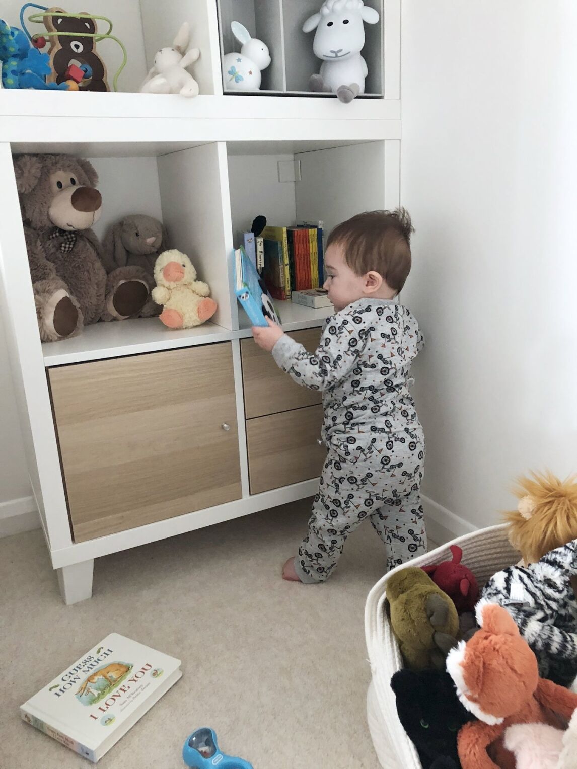 baby at the bookshelves