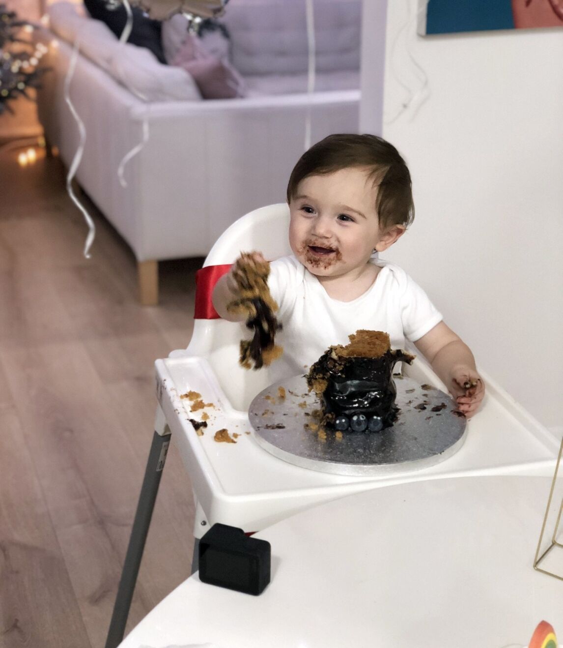 Max enjoying his first birthday cake
