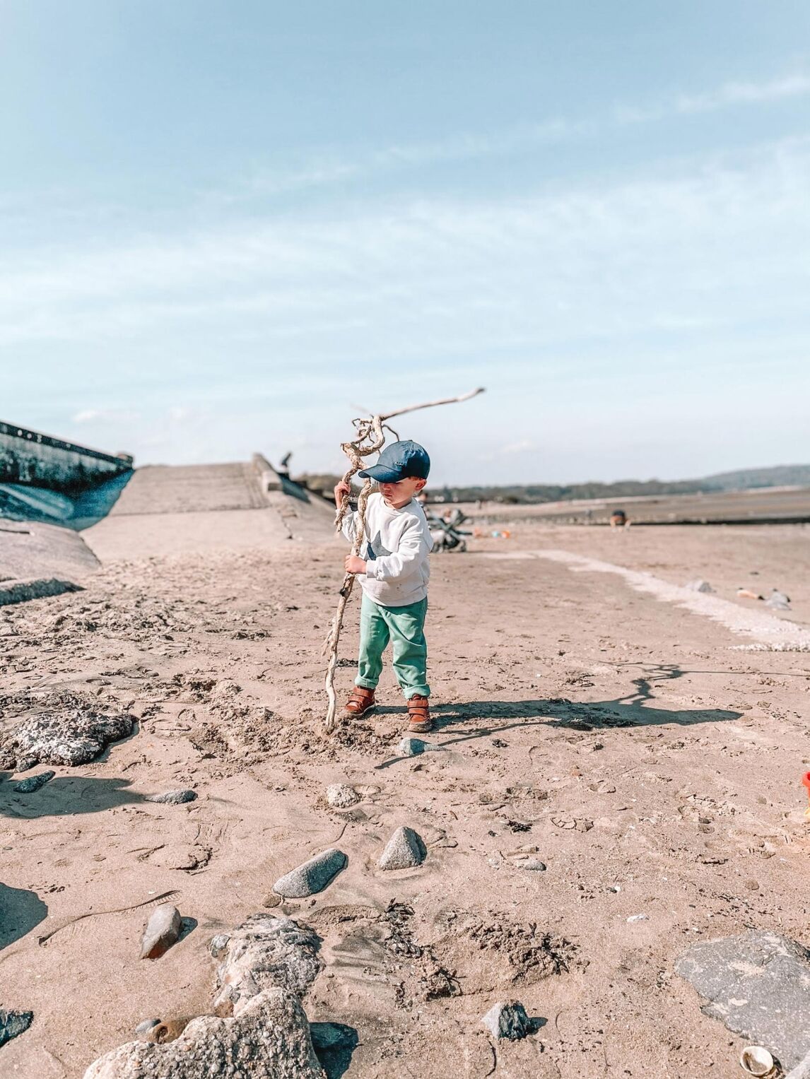 Max playing with driftwood on Cramond Beach