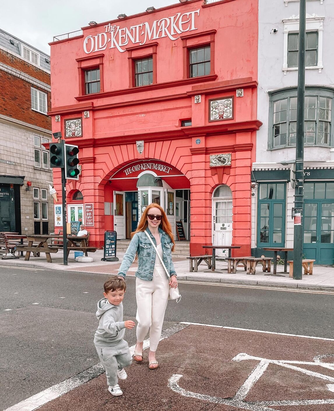Amber and Max crossing the road in front of the Old Kent Market, Margate