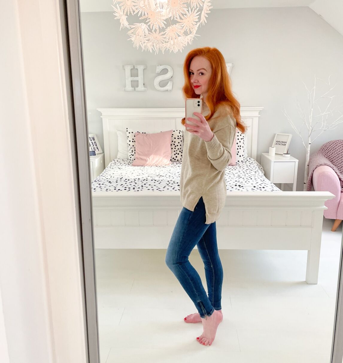 beige longline sweater with skinny jeans