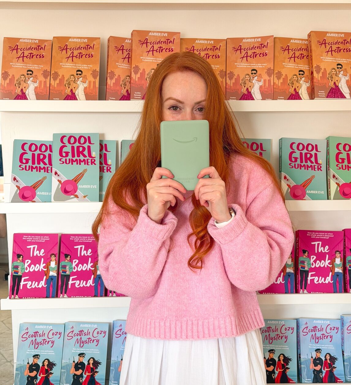 Author Amber Eve with her Kindle Paperwhite